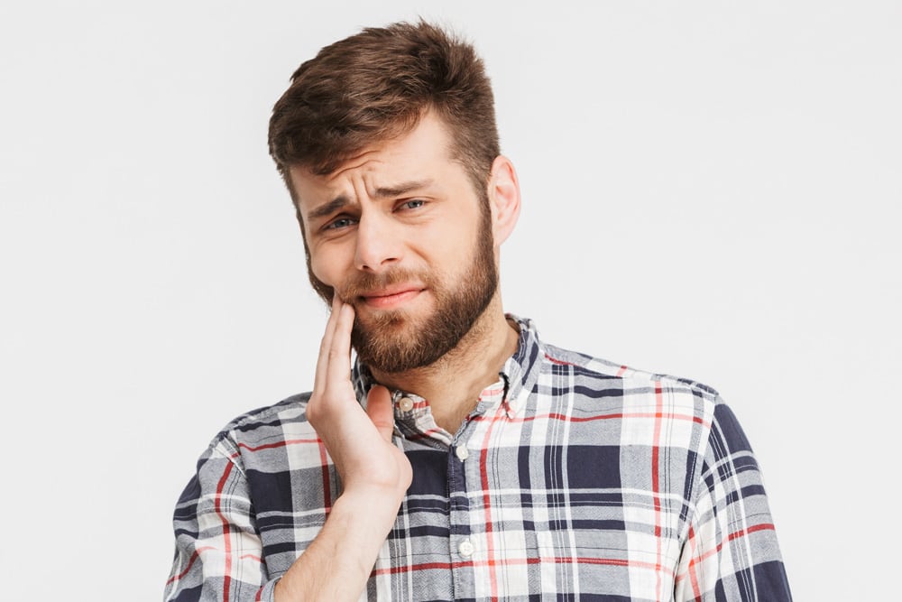 Gum recession showing exposed tooth roots