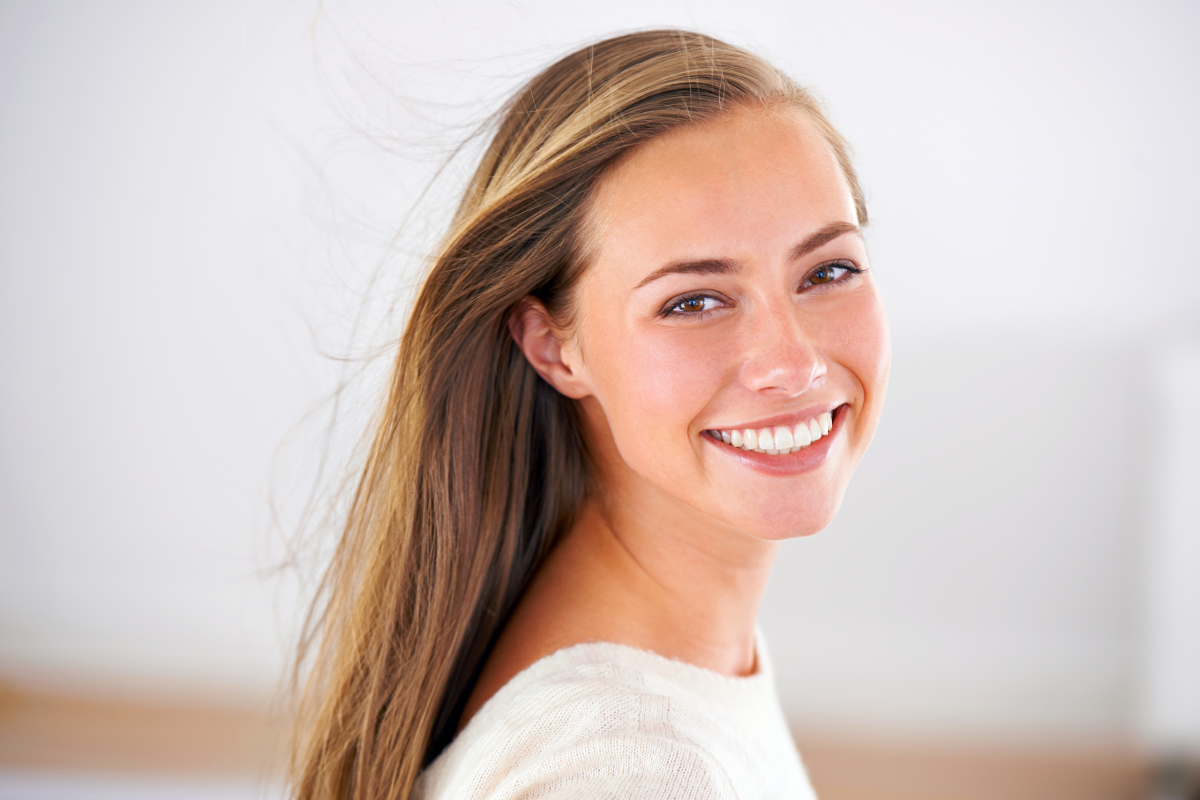 Confident smile with Invisalign results